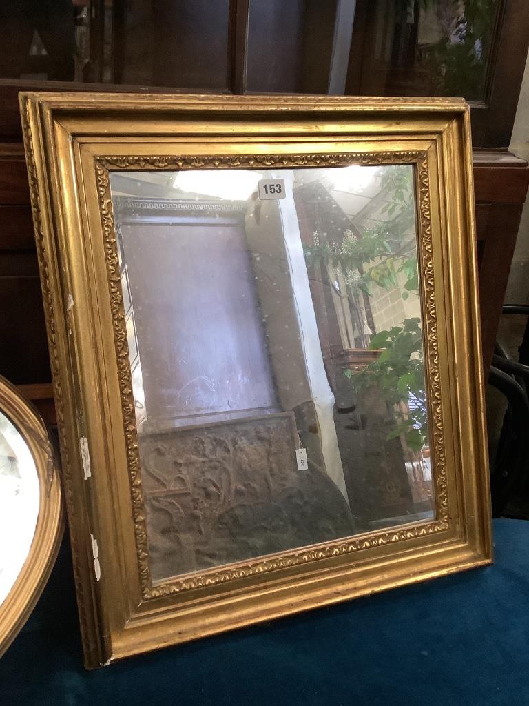 A rectangular gilt framed wall mirror, width 52cm, height 60cm, together with an oval gilt framed wall mirror